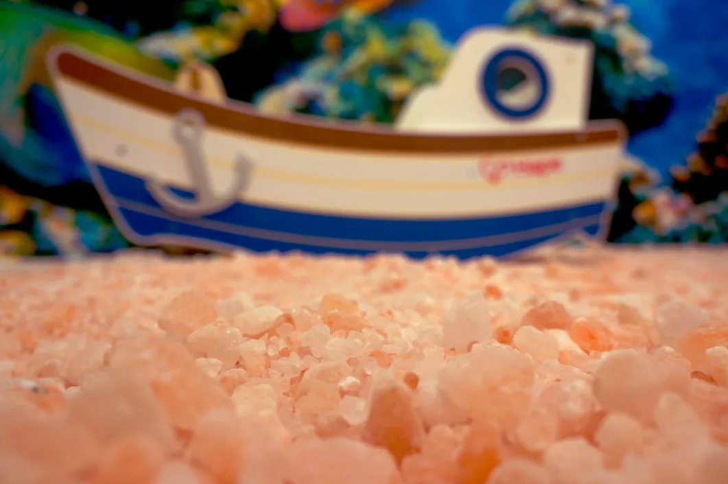 The children's salt room with toys on the salt floor